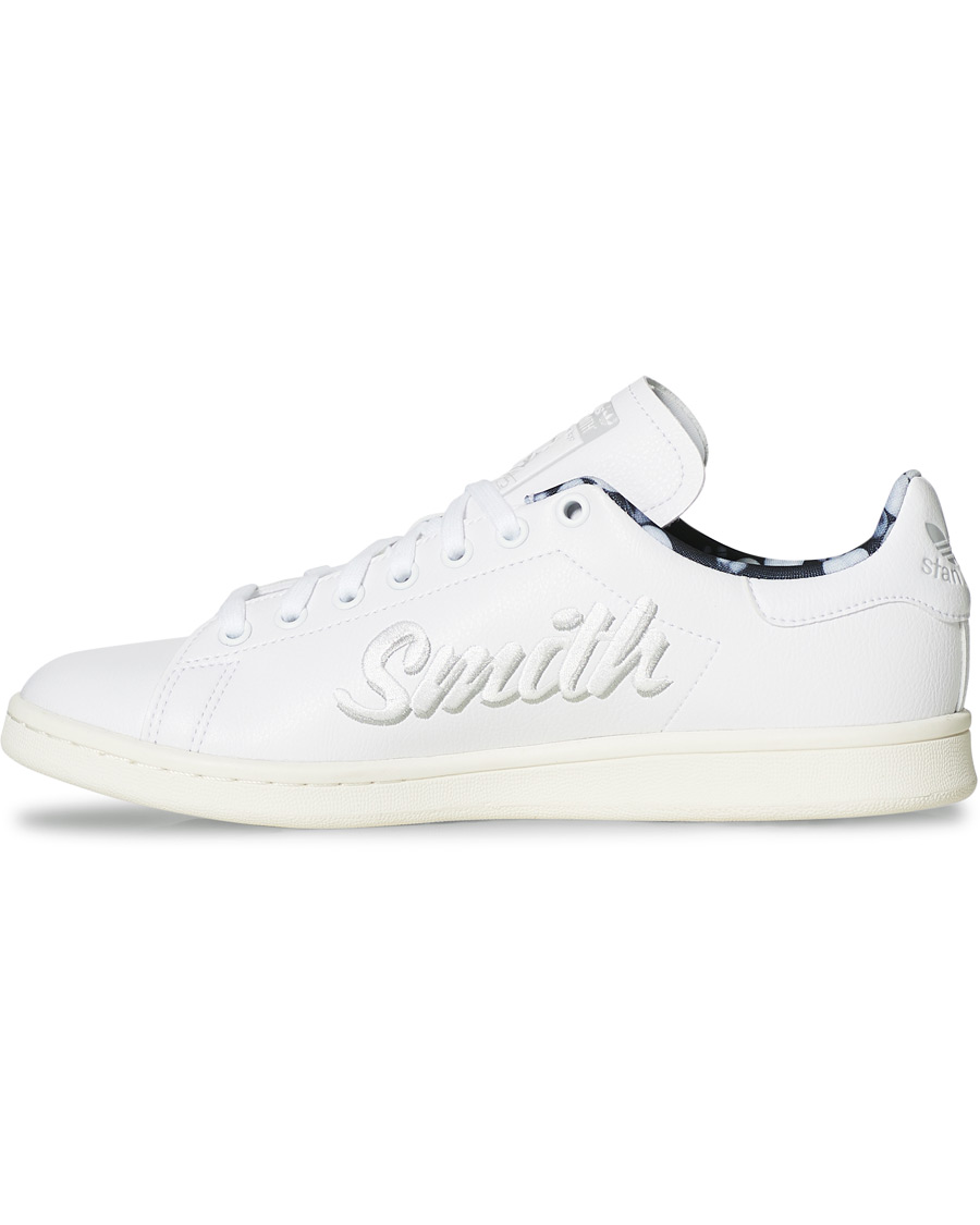 white and blue stan smiths